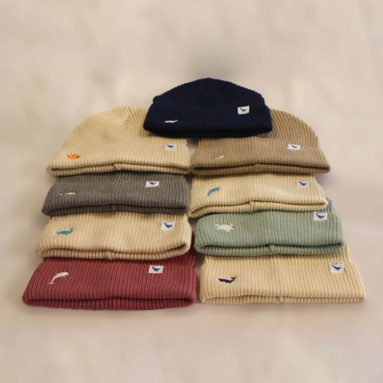 Ocean Icons organic cotton knit beanies in a range of colours embroidered with Australian marine wildlife.