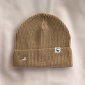 Ocean Icons organic cotton, sand beanie embroidered with a seal in white thread.