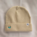 Ocean Icons organic cotton, beige beanie embroidered with a turtle in green thread.