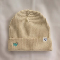 Ocean Icons organic cotton, beige beanie embroidered with a turtle in green thread.
