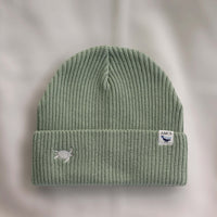 Ocean Icons organic cotton, sage beanie embroidered with a turtle in white thread.