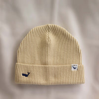 Ocean Icons organic cotton, beige beanie embroidered with a whale in navy thread.
