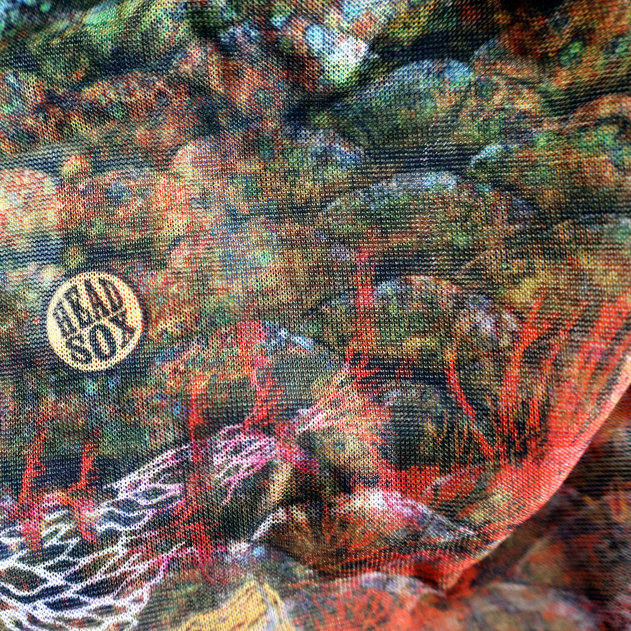 Close-up of the 'Ocean Life' buff fabric by Headsox in the multicoloured 'Coral Sea’ design.