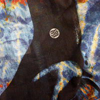 Close-up of the 'Ocean Life' buff fabric by Headsox in the multicoloured 'Manta Magic’ design.