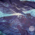 Close-up of the 'Ocean Life' buff fabric by Headsox in the multicoloured 'Whale Song’ design.