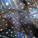 Close-up of the 'Ocean Life' buff fabric by Headsox in the multicoloured 'Whale Shark’ design.