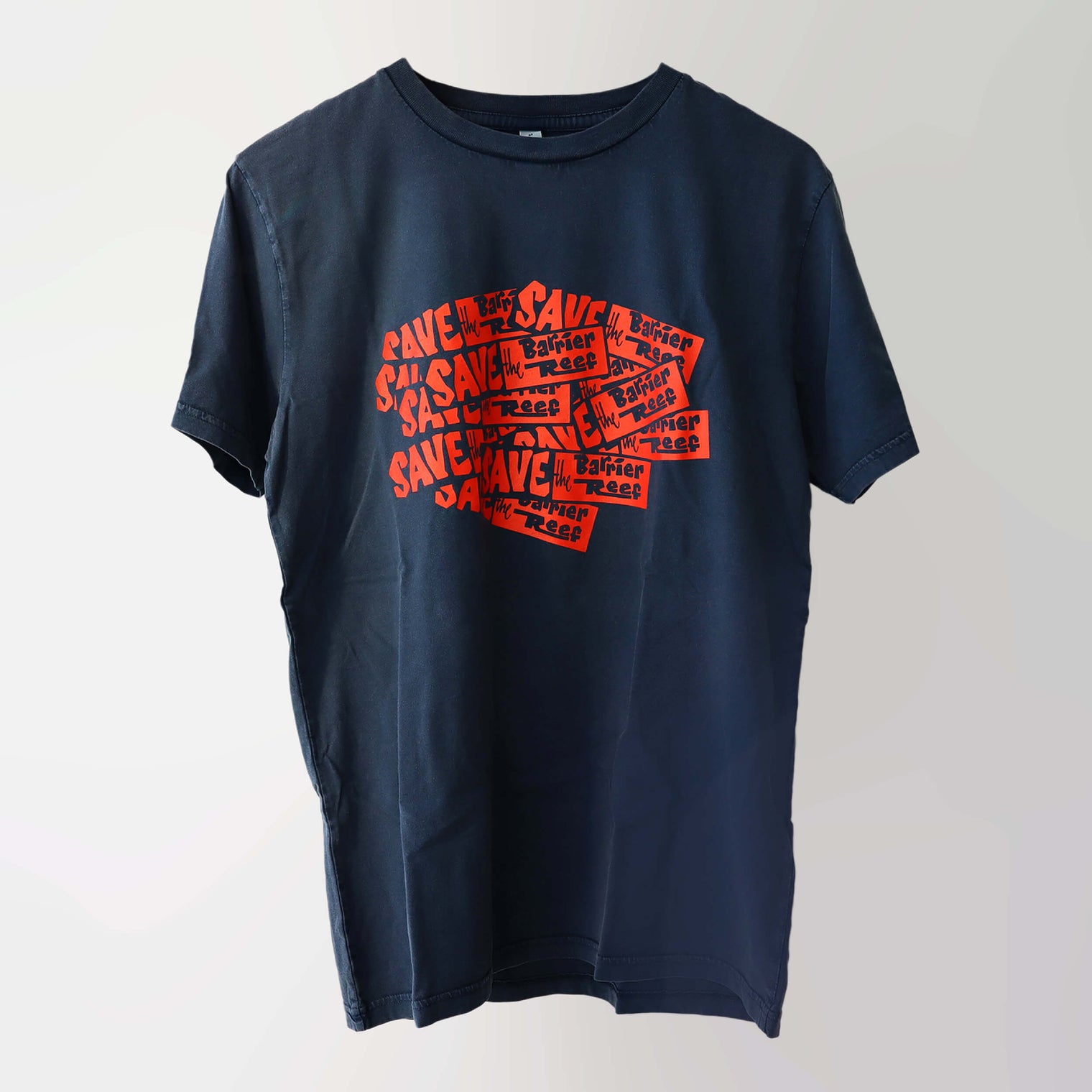 Era 1980s organic cotton, short sleeve, stone washed dark denim-blue t-shirt (front) with a red repeat pattern print of the “Save the Barrier Reef” campaign slogan.