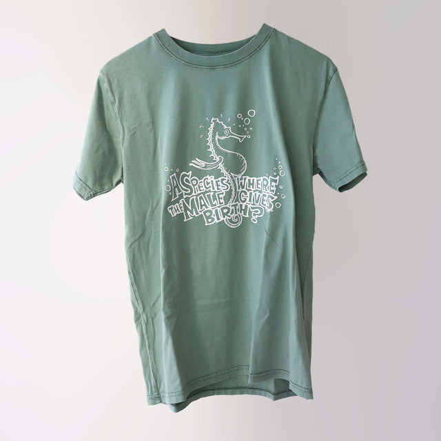 Era 2000s organic cotton, short sleeve, sage t-shirt (front) with a white print of a seahorse and lettering “A species where the male gives birth?”.