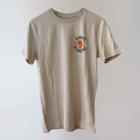 Sand-coloured 'Fight Plastic' organic cotton t-shirt (front) with navy and orange print artwork of a fist.