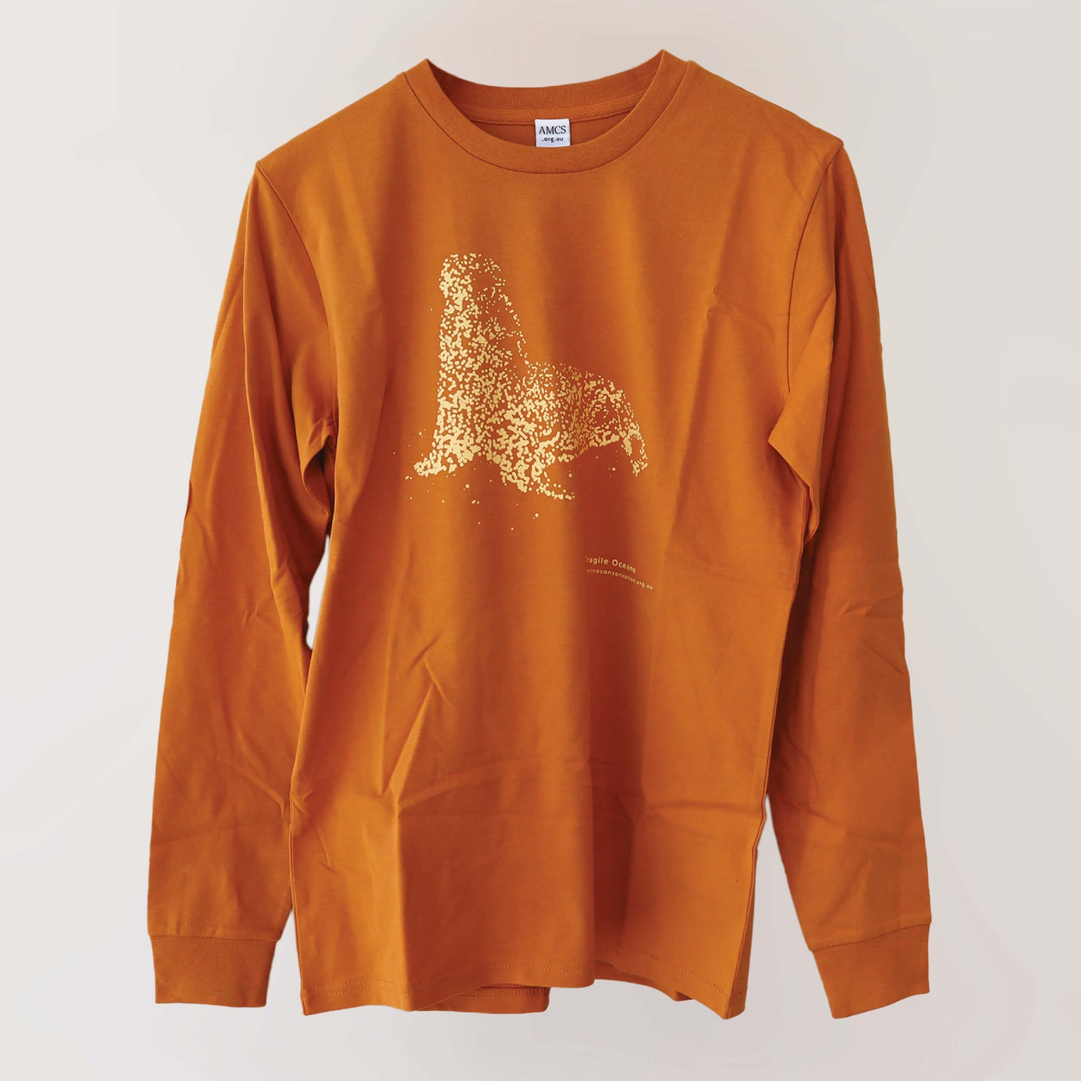 Fragile Oceans organic cotton, long sleeve, orange t-shirt with seal print rendered in water bubbles.