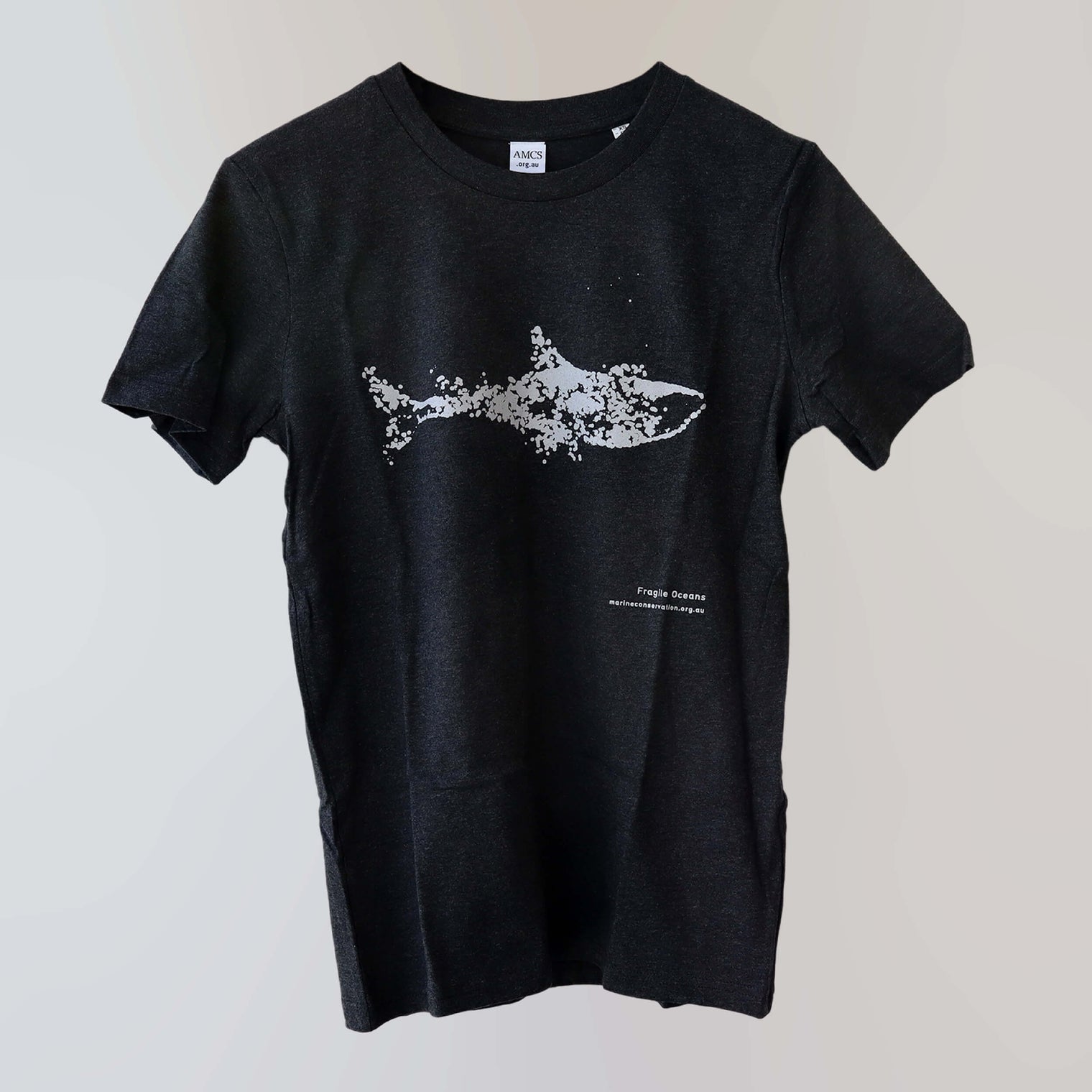 Fragile Oceans organic cotton, short sleeve, black t-shirt with shark print rendered in water bubbles.