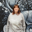 Fragile Oceans heathered grey sweatshirt with manta ray screen print worn by our AMCS team.