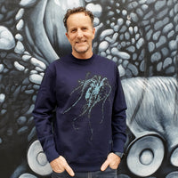 Fragile Oceans navy sweatshirt with octopus screen print worn by our AMCS team.