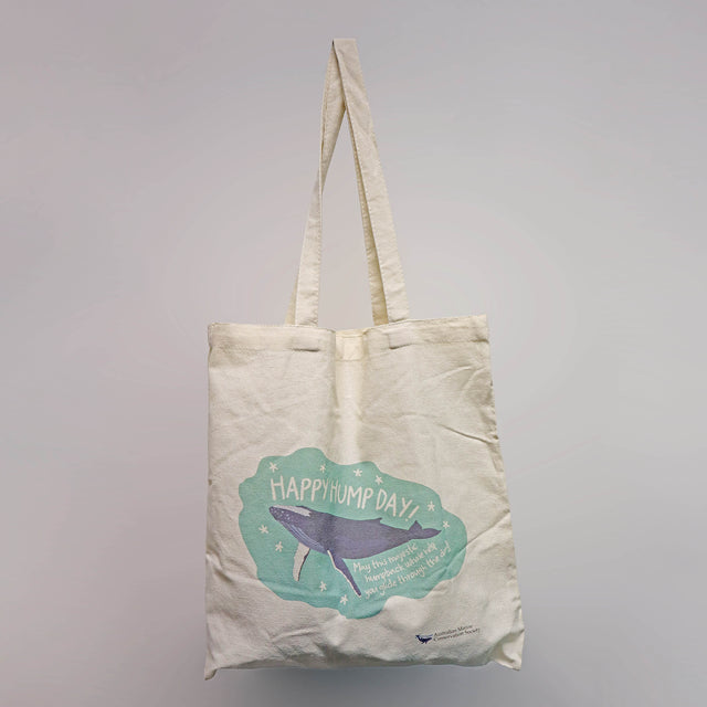 'Happy Hump Day!' recycled natural-coloured cotton tote bag a navy and green illustration print of a humpback whale by Red Parka.