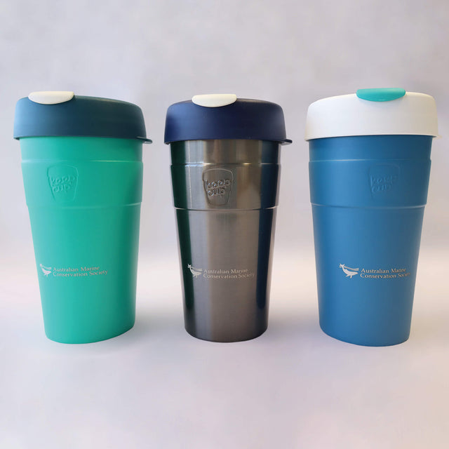 Three large reusable, thermal travel cups by KeepCup in green, silver and blue.