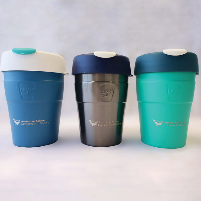 Three medium reusable, thermal travel cups by KeepCup in green, silver and blue.