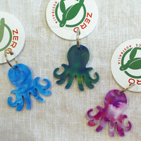 Purple, blue and green octopus shaped keyrings made with recycled plastic milk bottle lids.