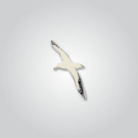 Lapel pin of an albatross by Red Parka. 
