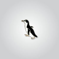 Lapel pin of a little penguin by Red Parka. 