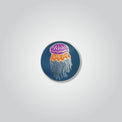 Lapel pin of a lion's mane jellyfish by Red Parka. 