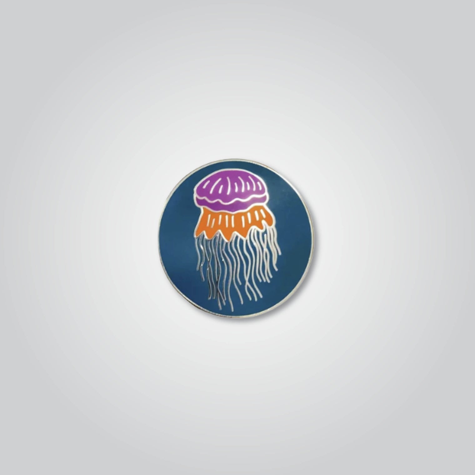 Lapel pin of a lion's mane jellyfish by Red Parka. 