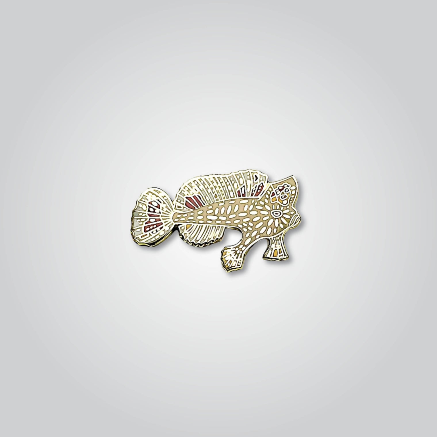 Lapel pin of a spotted handfish by Red Parka. 