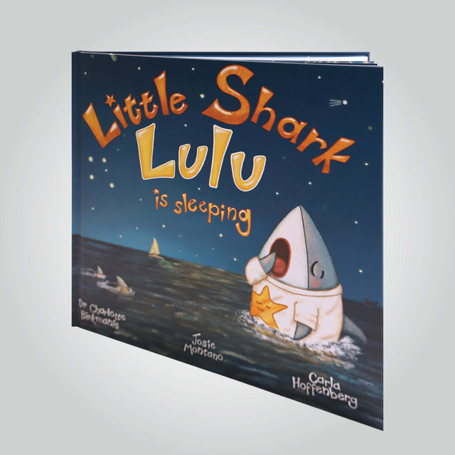 'Little Shark Lulu is Sleeping' book cover (front) by Dr Charlotte Birkmanis, Josie Montano and Carla Hoffenberg, featuring an illustration of a shark pup yawning in the ocean, with the night sky in the background.