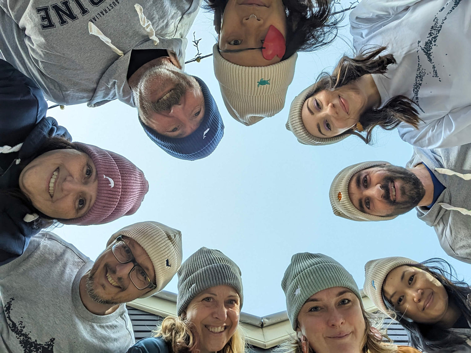 AMCS team wearing the Ocean Icons organic cotton beanies.