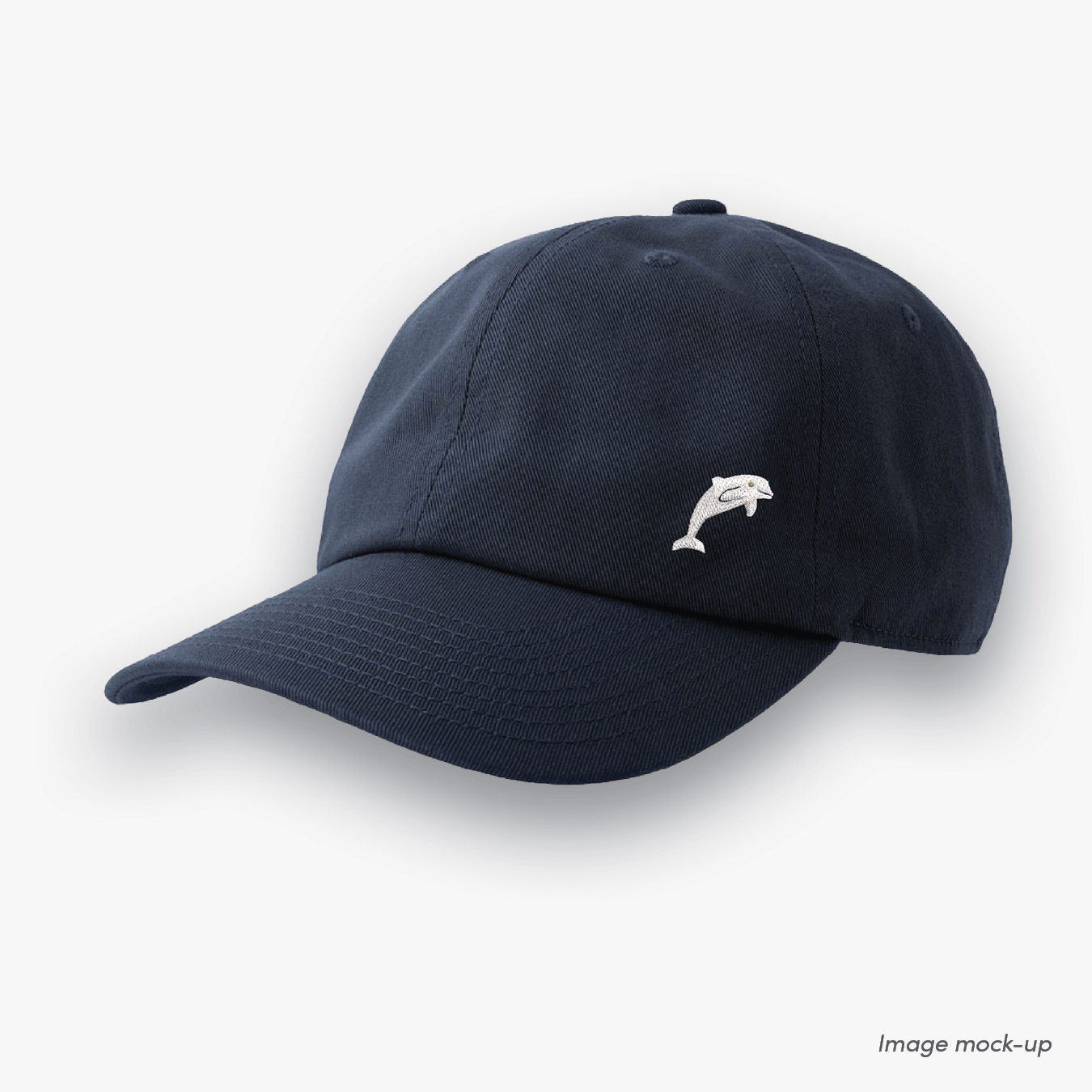 Navy-coloured Ocean Icons Dad cap with dolphin embroidery on the side.