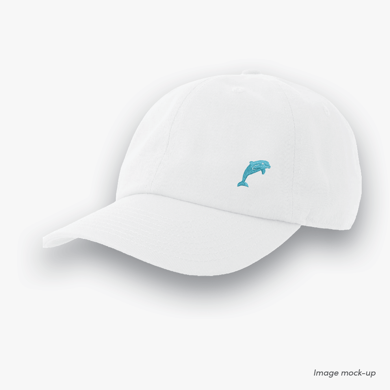 White-coloured Ocean Icons Dad cap with dolphin embroidery on the side.