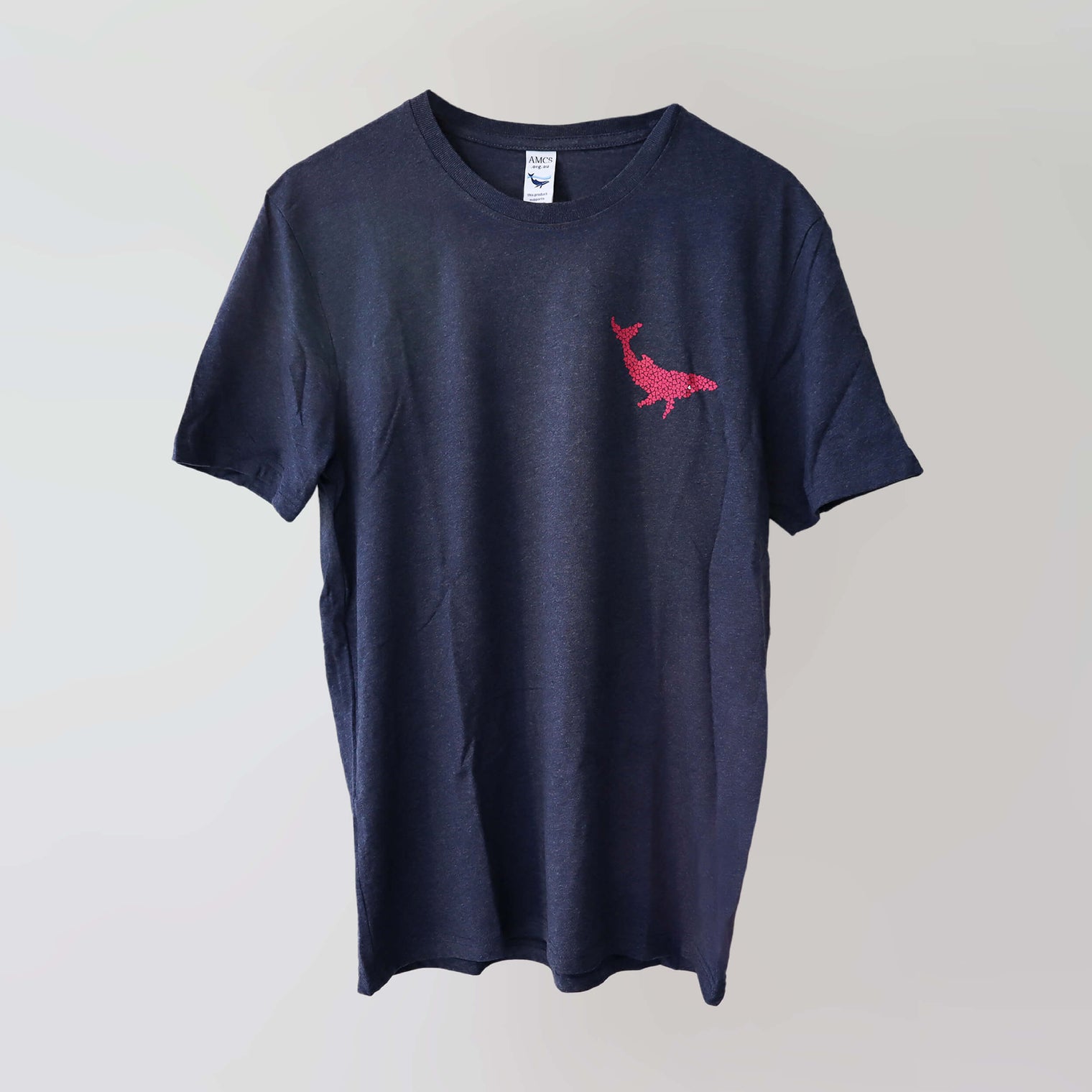 Ocean Love crew neck navy t-shirt (front) with a pink humpback whale print, made from recycled materials. 
