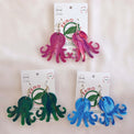 Colourful collection of octopus-shaped dangle earrings, made with recycled plastic milk bottle lids by Zero Plastics Australia.
