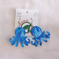 Blue octopus-shaped dangle earrings, made with recycled plastic milk bottle lids by Zero Plastics Australia.