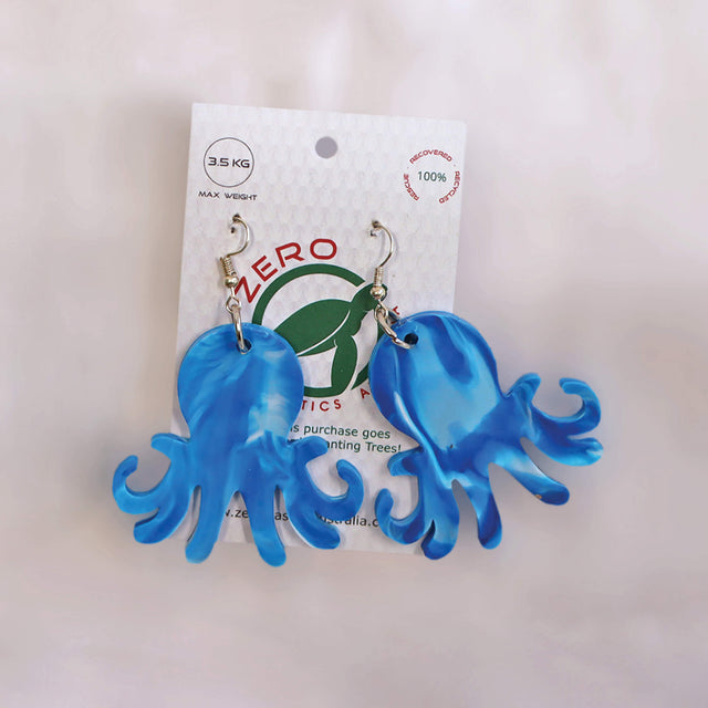 Blue octopus-shaped dangle earrings, made with recycled plastic milk bottle lids by Zero Plastics Australia.