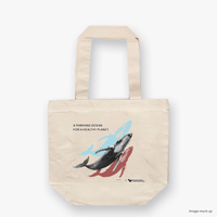 A natural canvas tote bag featuring screen-printed artwork of a humpback whale by Guy Shoval, together with the AMCS vision statement: "A thriving ocean for a healthy planet".  